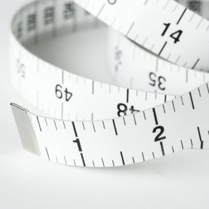 closeup-of-measuring-tape-min-600x492